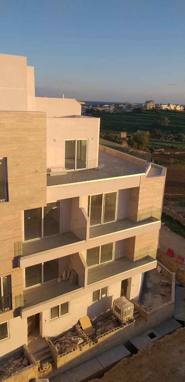 Frameless glass railing with 16mm tempered clear glass.